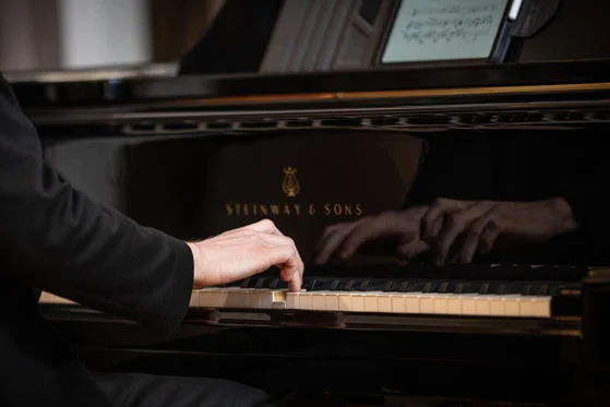 Pianist performing at a lunchtime concert