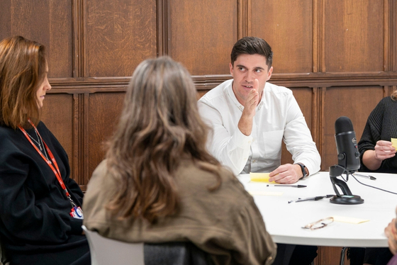 People taking part in a round-table discussion.