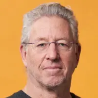 A headshot of Professor Ehud Shapiro against an orange background