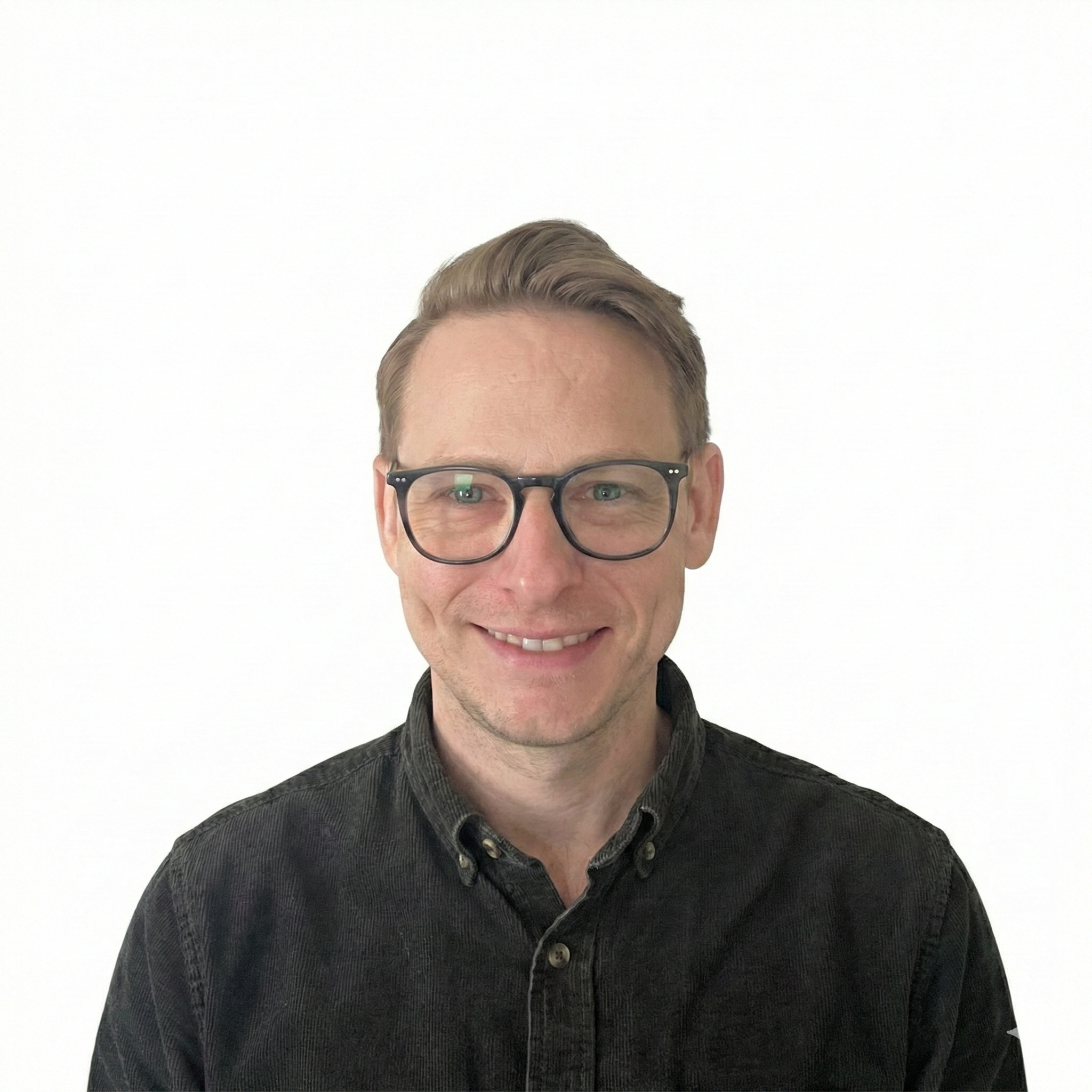 headshot of a man with glasses