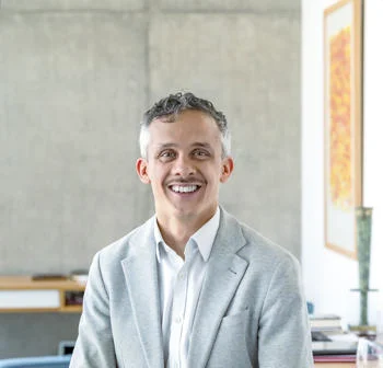 Headhshot of Kieron Boyle in a blazer and shirt