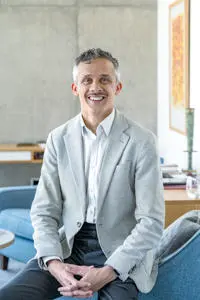 Headhshot of Kieron Boyle in a blazer and shirt