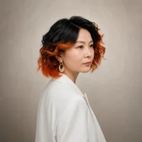 Linzhi Zhang headshot. She is wearing a white jacket and facing away from the camera with her head angled back.