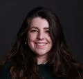 Lucy Garbett smiling with arms folded