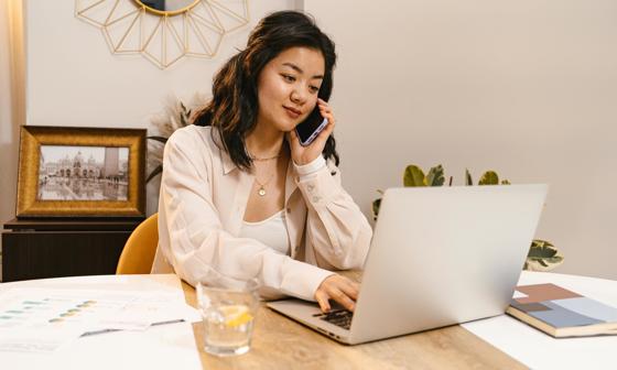 Global-Programmes-student-sat-at-desk-at-home-on-laptop