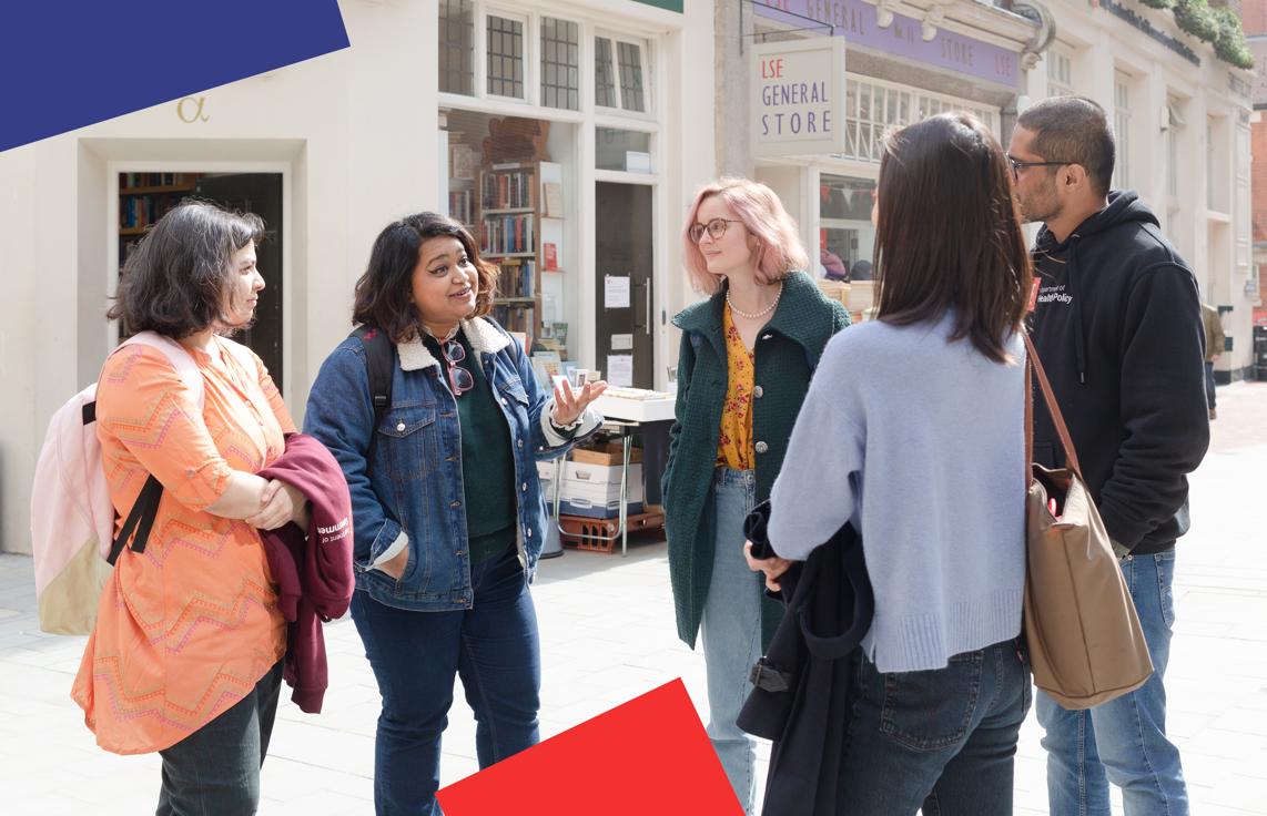 A group of students talking outside of the LSE General Store