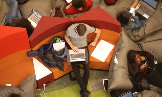 Overhead view of student seated on a sofa