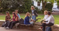 Young people laughing in a park
