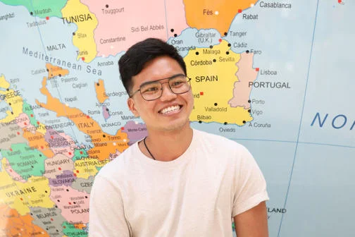 PhD student next to the World Turned Upside Down on the corner of Portugal Street and Sheffield Street