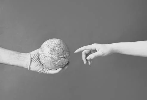 Hand touching the world