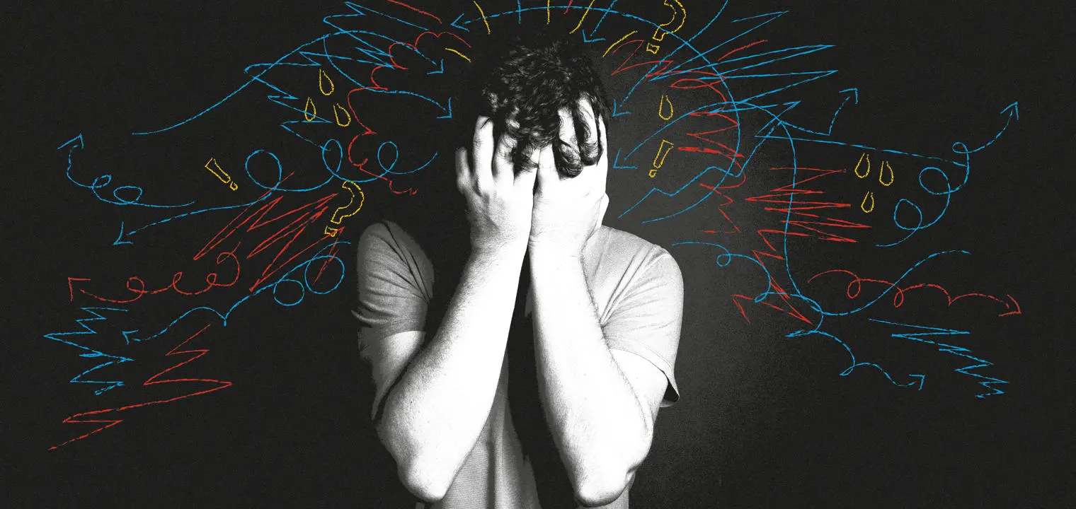 A man with his head in his hands.