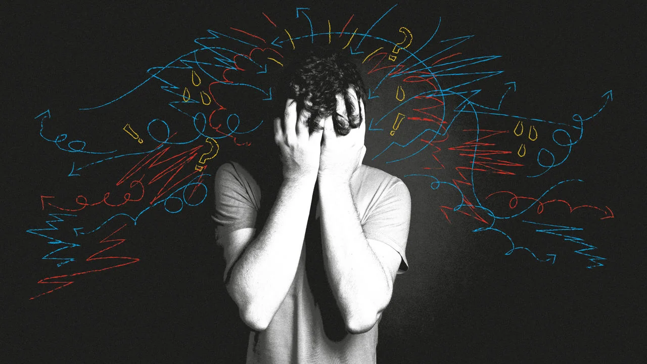 A man with his head in his hands.