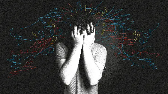 A man with his head in his hands.