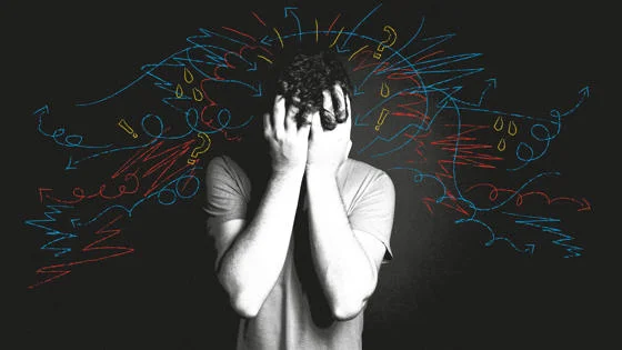 A man with his head in his hands.