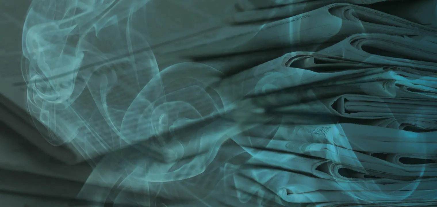 A pile of newspapers with smoke overlaid.