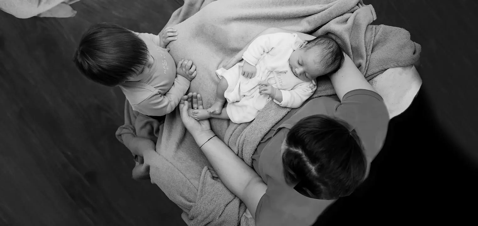 two babies being held