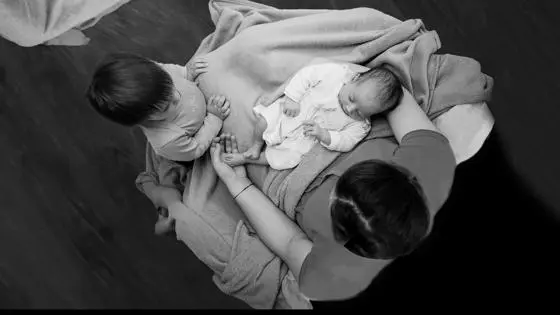 two babies being held