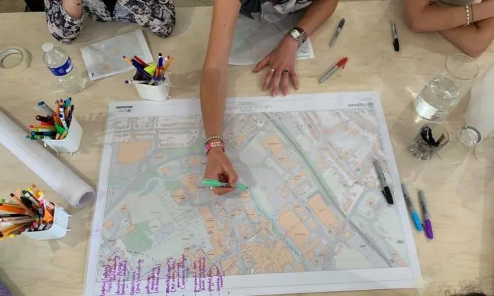 Researchers-in-residence in Trowbridge annotating a map with their interventions for better public spaces