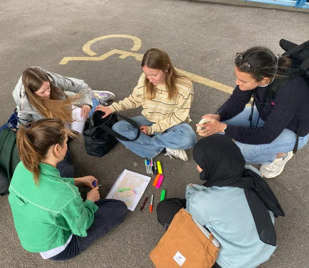 Researchers-in-residence reflecting on and mapping the area around a carpark and retail centre in Trowbridge.