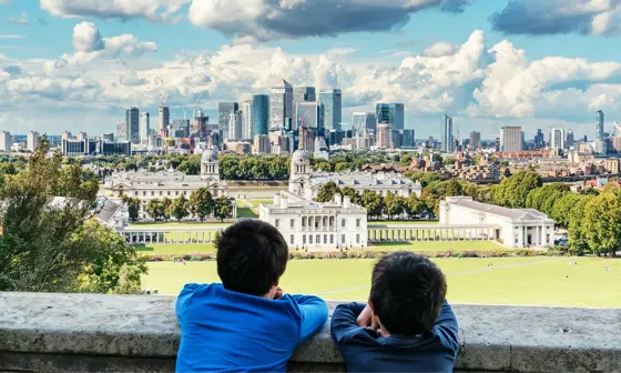 Two boys looking at park with a view of the city