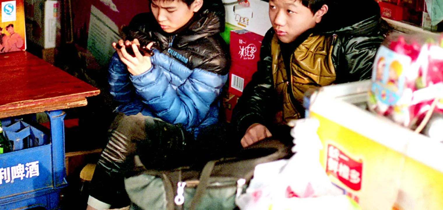 children using a smartphone