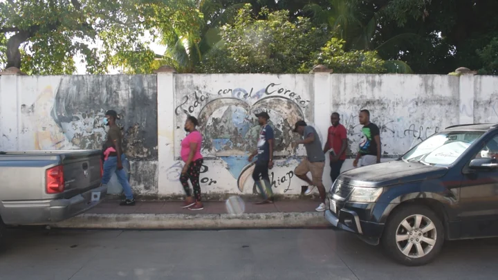 Haitians on their way to an appointment at the Mexican Commission for Refugee Assistance
