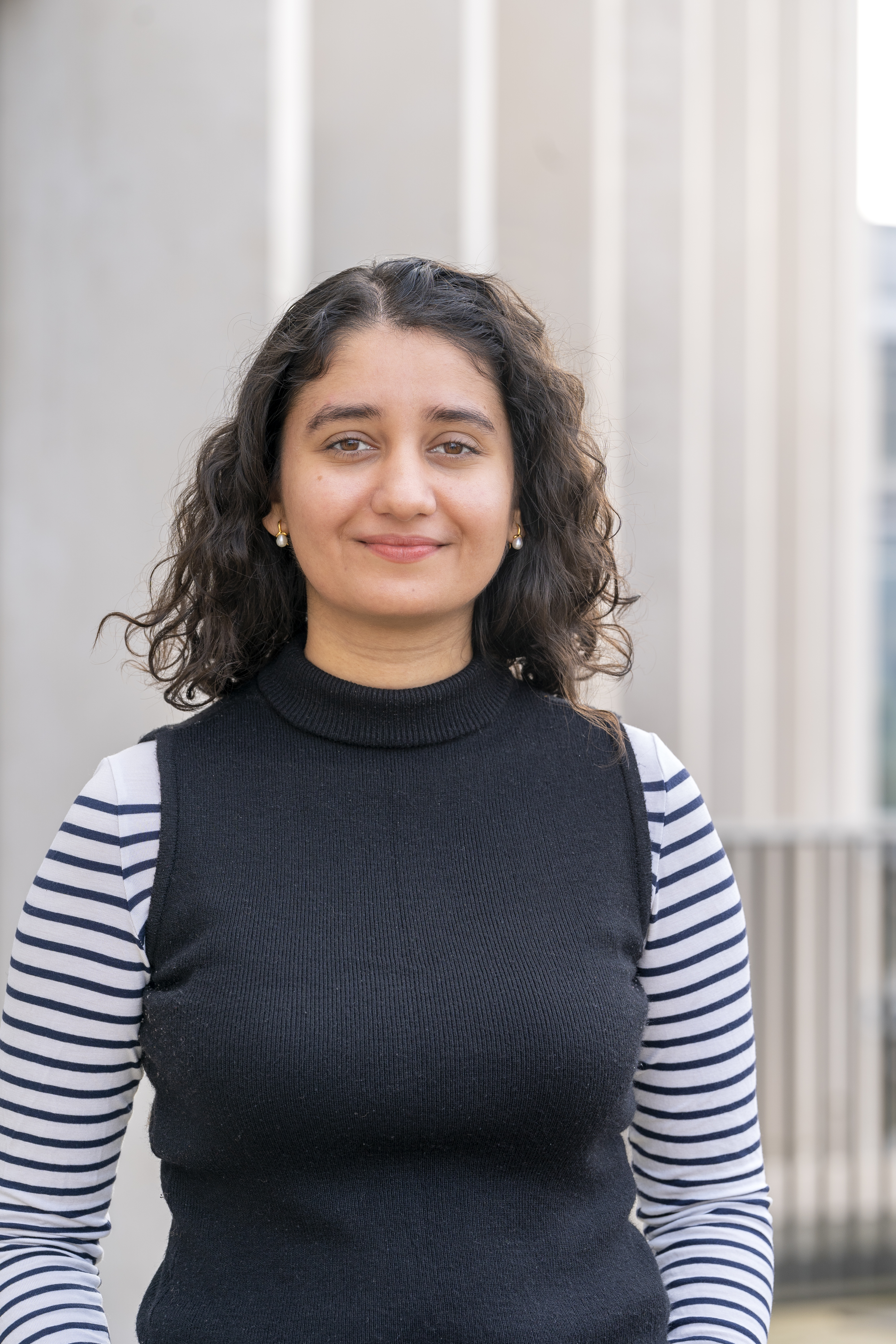 headshot of woman in a black turtleneck