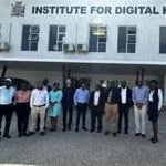 Researchers standing outside the Institute for Digital Health building