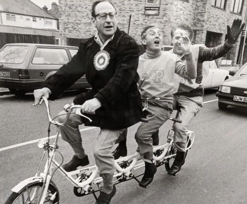 Three men on a tandem