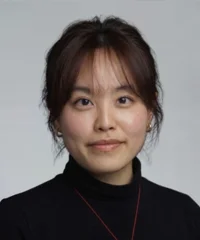 Tianyi Wu in front of grey