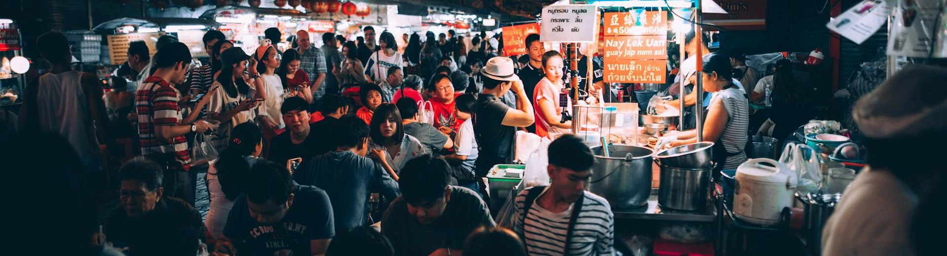 People eating on street at night