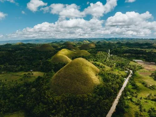 A bird eye view of a green rural landscape in he Philippines.