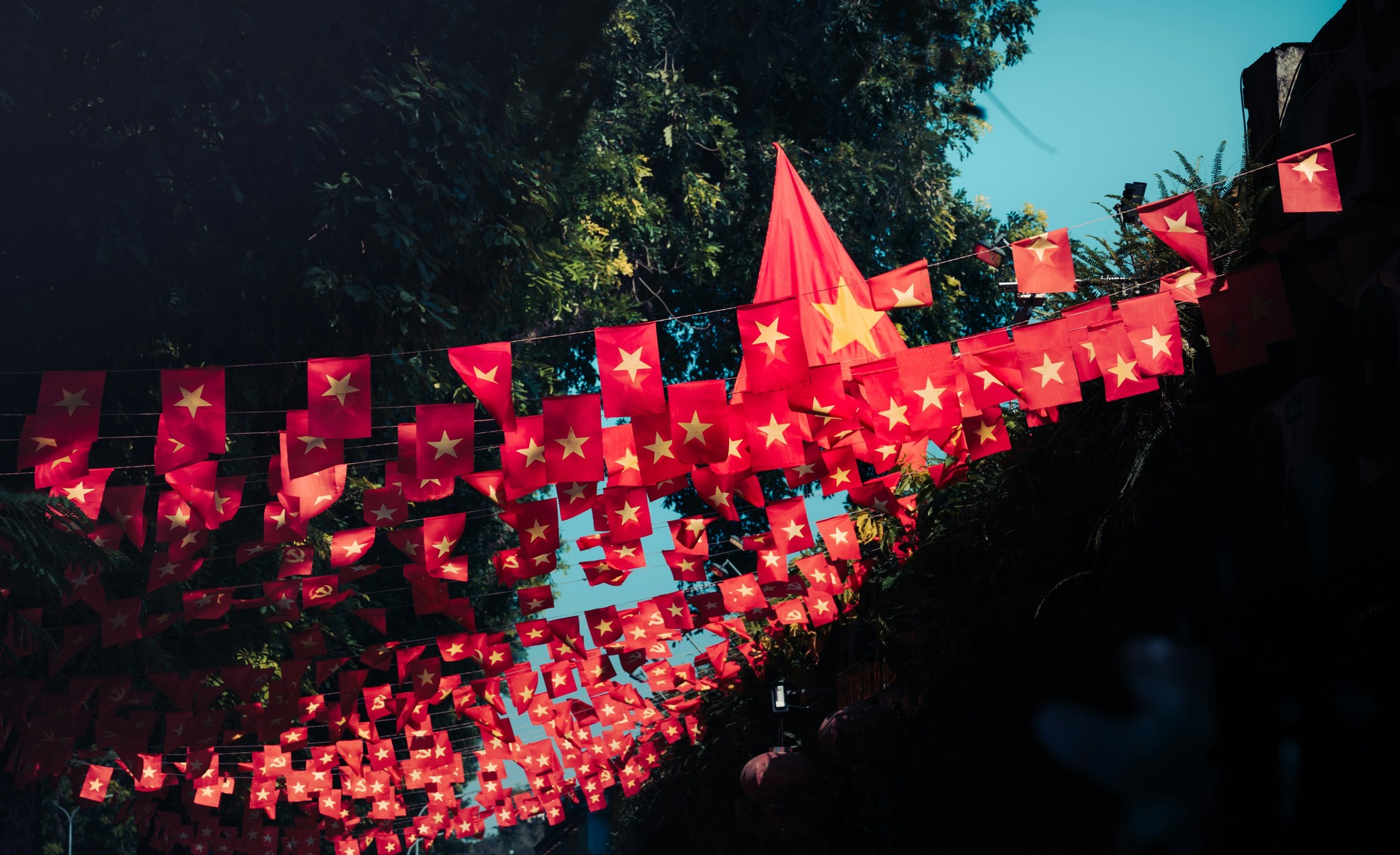 Vietnamese flag bunting stretching across the street.