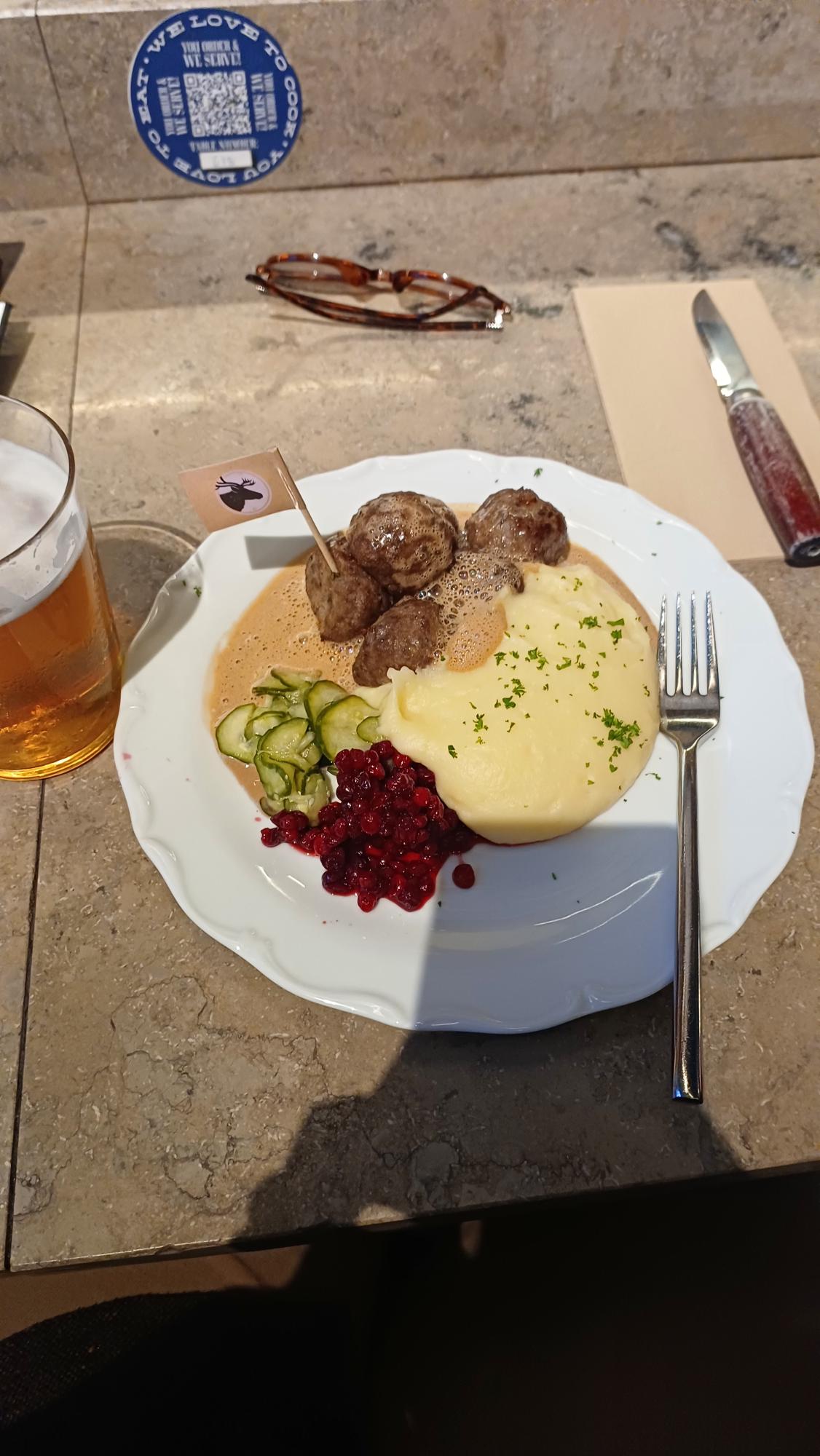 A traditional Swedish meal, with meat balls, gravy and mashed potatoes.