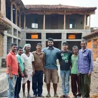 Siddharth Menon on an earth building construction site in India.
