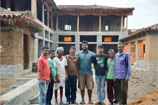 Siddharth Menon on an earth building construction site in India.