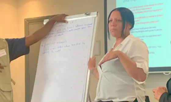 People presenting infront of a room.