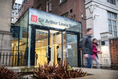 People walking in and out of the entrance to Sir Arthur Lewis Building