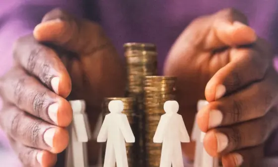 a pair of hands on either side of a pile of coins which is encircled by stick men figurines