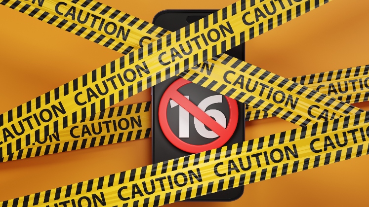 Phone with a number 16 crossed out on the screen, covered in yellow 'caution' barrier signs