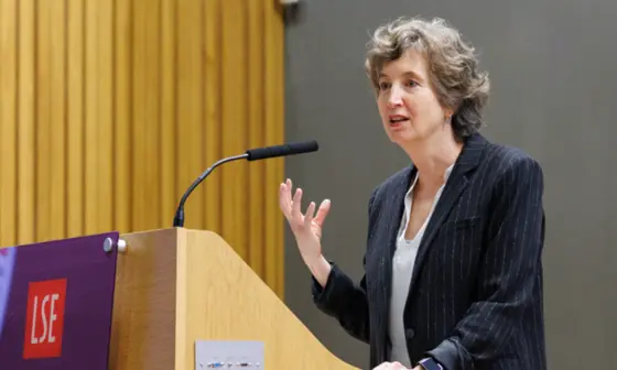 woman speaking at a lecturn