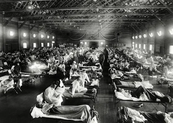 Black and white photo of patients in a makeshift Spanish Flu ward