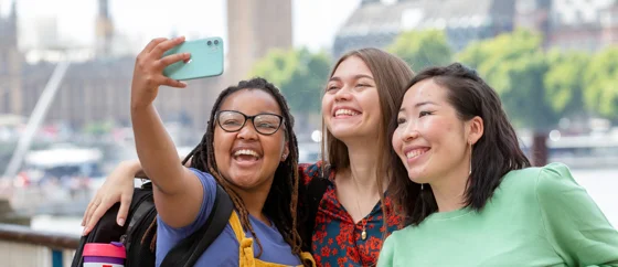 Three students taking a photo