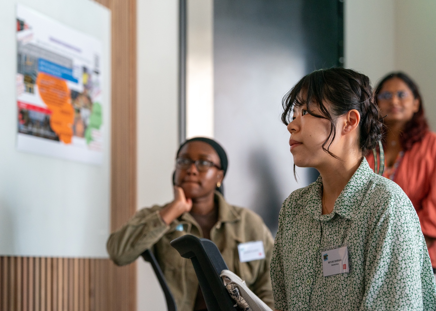 Group of CIVICA student looking at a map on a wall