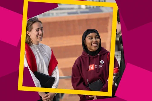 Two students smiling on campus