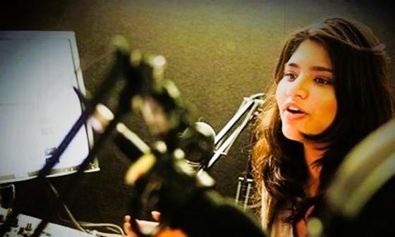young woman at a microphone