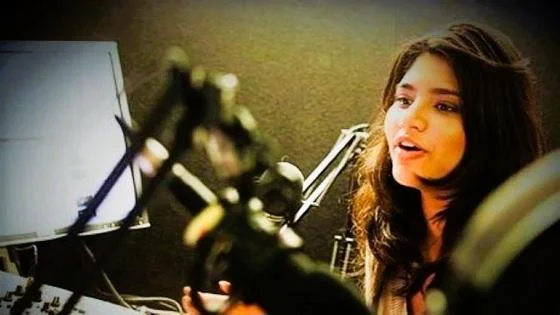 young woman at a microphone