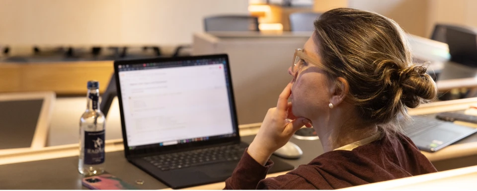 Student on laptop in classroom