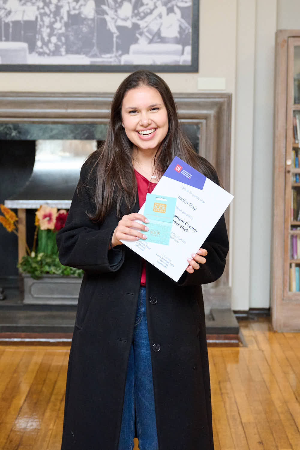 Content creator of the year posing with a certificate.