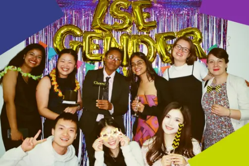 A group of students and faculty laughing at a ceebration